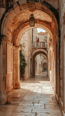Fototapeta premium A picturesque alleyway in a historic town, framed by weathered stone arches, creates a captivating journey for the eye, evoking the rich tapestry of architecture 