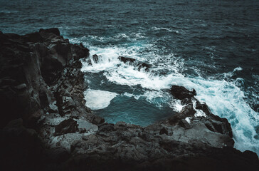 Dramatic Volcanic Coastline with Ocean Waves and Dark Basalt Cliffs in Iceland