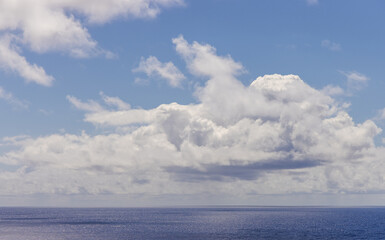 Tranquil Cloudscape Over the Pacific Ocean with Blue Sky and Gentle Seas