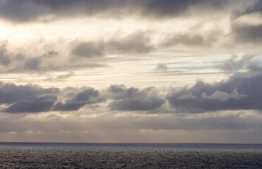 Serene Cloudscape Over The Vast Pacific Ocean During Tranquil Dusk