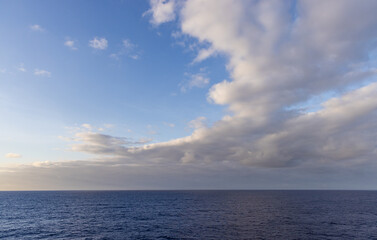 Ocean Horizon With Dramatic Clouds Under a Clear Blue Sky