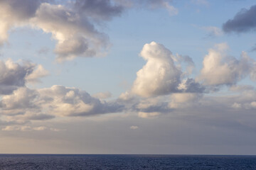 Serene Ocean View with Soft Cloudscape in Clear Sky