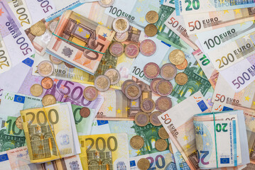 Euro coin cent with 10, 20, 50 and 100 200 500 paper money, top view