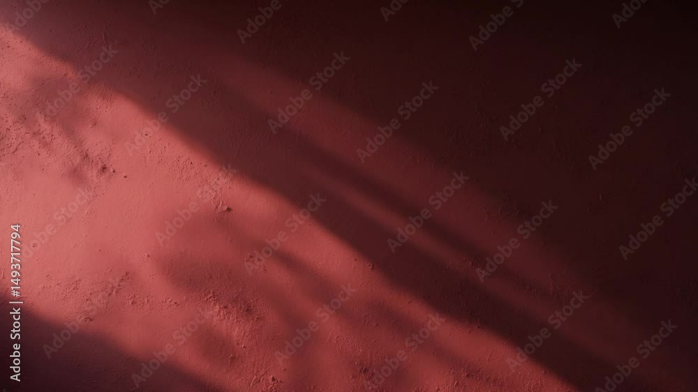 Poster close-up of an empty red textured wall with shadows and sparse background