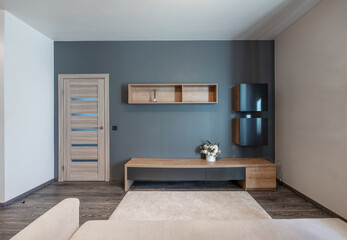 Modern Home Living Room Interior with Minimalist Furniture and Blue Accent Wall