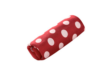 Polka dot kitchen towel rolled into a roll isolated on white background