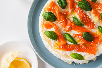 Omelette Poulard. Omelette of Mother Poulard. French omelette with whipped egg whites, lightly salted trout and basil. Beautiful, healthy and tasty breakfast. Top view. Close-up. Copyspace