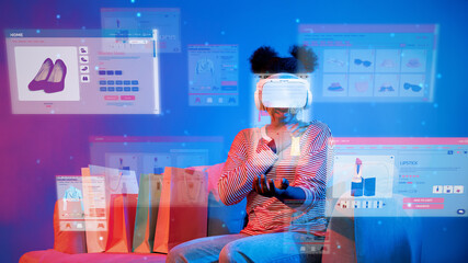 African girl looking list while wearing VR glass and sitting at sofa with shopping bag. Teenager using augmented reality glasses while choosing and buying product at neon color background. Ingenuity.