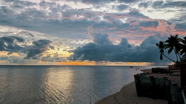 Scenic shot of the sky, filled with dramatic clouds, colored with hues of orange and pink