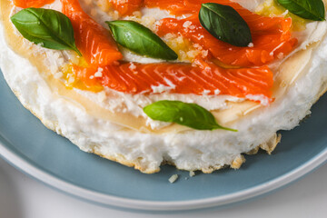 Omelette Poulard. Omelette of Mother Poulard. French omelette with whipped egg whites, lightly salted trout and basil. Beautiful, healthy and tasty breakfast. Top view. Close-up. Copyspace