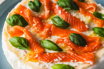 Background with texture of Omelette Mother Poulard. French omelette with whipped egg whites, lightly salted trout and basil. Use for banner and menu. Top view. Close-up. Copyspace
