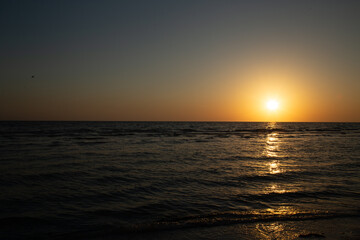 Sunset on gorgeous white quartz sand beach on Siesta Key in Sarasota, Florida