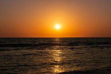 Fototapeta premium Sunset on gorgeous white quartz sand beach on Siesta Key in Sarasota, Florida