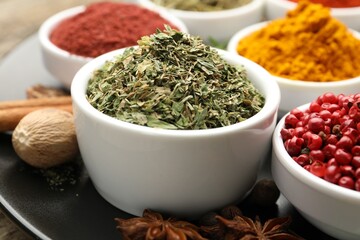 Many different aromatic spices on table, closeup