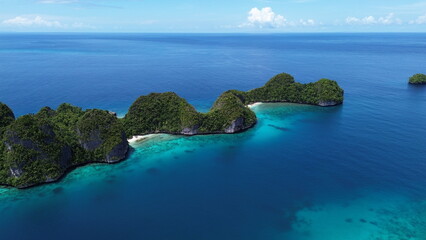 Remote lagoon at Wayag island consisting of limestone islands, Raja Ampat, West Papua, Indonesia