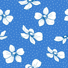 Anemone flowers scattered over blue polka dot background. Botanical seamless vector pattern. Floral ornament