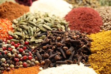 Different aromatic spices as background, closeup view
