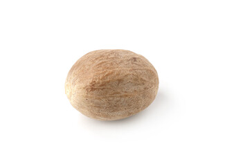 One whole fresh nutmeg isolated on white