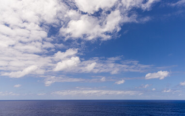 Scenic Seascape With Vibrant Blue Sky and Clouds over the Pacific Ocean