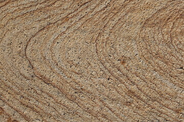 Naklejka premium Natural swirls, lines and textures of granite stone create a captivating brown backdrop