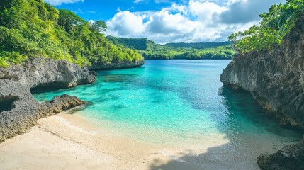 Fototapeta premium Scenic beach view with clear blue water and rocky cliffs under bright sunny sky