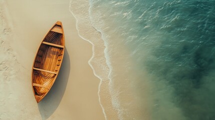 Boat on a sandy beach with gentle waves and clear blue sky during a sunny day