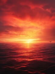 Photograph of a beautiful sunset over the ocean. the sky is filled with vibrant orange and red hues, with the sun partially hidden behind the clouds.