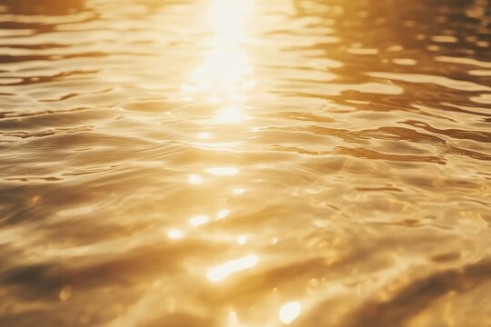 Close up of water surface with sunlight reflections and sparkling waves