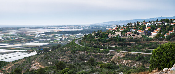 Summer Israeli Landscape with Mediterranean Village Zikhron Ya'akov Overlooking the Sea in evening....