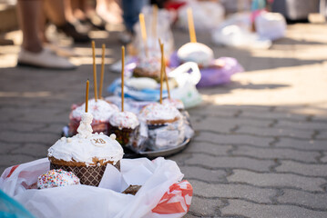 Easter cakes with candles on a sunny holiday day