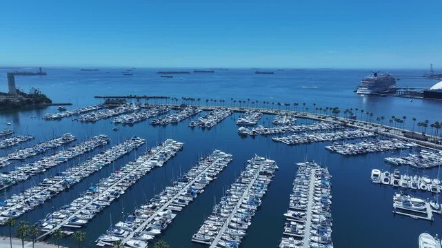 Aerial Long Beach city California marina overhead circle 3. Coastal city near Los Angeles. Cargo and container ship terminal. Cruise ship destination. Seaside resort boat marina and park.