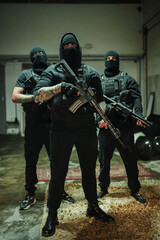A powerful trio of mercenaries stands ready for action, showcasing their tactical rifles and fierce...