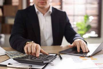 Professional banker working at desk in office, closeup