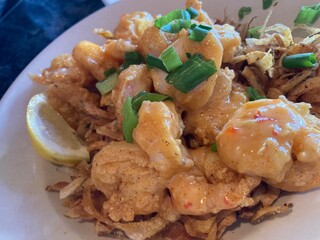 crispy spicy shrimp on potato straws