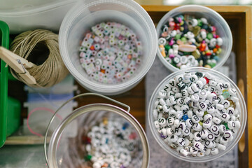 Colorful alphabet beads and craft supplies promoting early childhood development