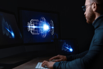 Engineer working with digital drawing at table in office