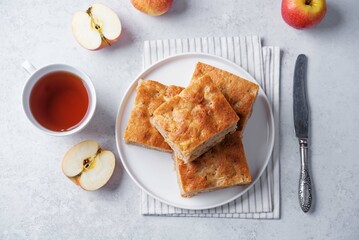 Apple cake in a plate on a white background