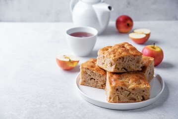 Apple cake in a plate on a white background