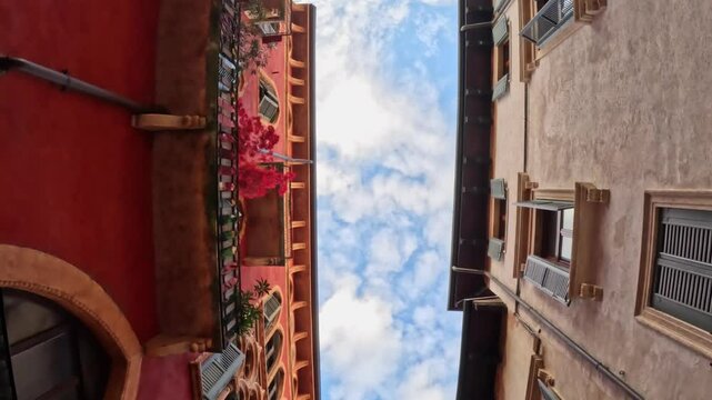 Walking through Verona's Old Town, seeing the sky as a small stripe between historic buildings.