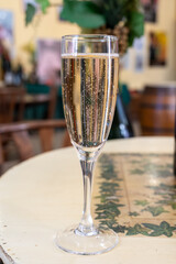 Pouring and tasting of dry sparkling wine brut, grand reserve, champagne in Ay-Champagne wine making village in Vallee de la Marne, , Champagne region, France