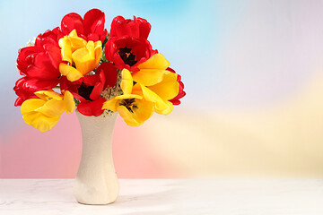 Still life with beautiful spring blooming tulips in vase on elegant background. Abstract flower arrangement and banner for screen, floral holiday card with summer greeting concept