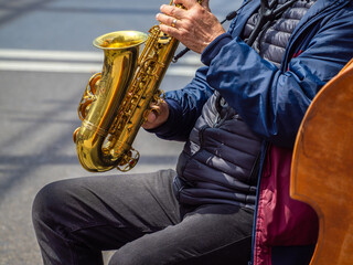 Musician Playing Saxophone in Urban Setting