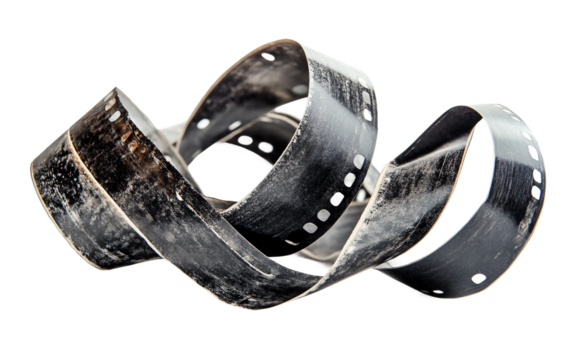 Closeup of curled monochrome film strips arranged artistically on a flat surface showcasing classic photography isolated on white background PNG