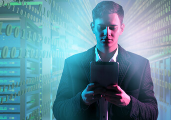 Young man using tablet in server room with binary code overlay, representing cybersecurity, data analysis, and digital technology. – IT. Cybersecurity. Data Science.
