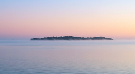 Obraz premium Misty Island at Sunrise Over Calm Water