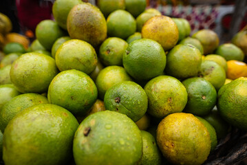 oranges arranged in a wooden basket for sale at a street market. Citrus fruit. Healthy eating.