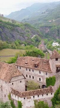 Roncolo castle (runkelstein) in bolzano, south tyrol, showcasing nature and historic architecture, aerial view