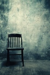 Solitary Wooden Chair Against Weathered Wall: A Moody Still Life