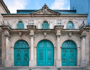 Obraz premium photo majestic building with ornate turquoise doors and stone facade