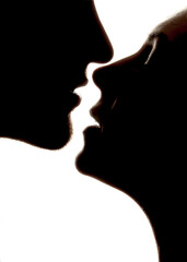 Silhouette of a couple kissing 
